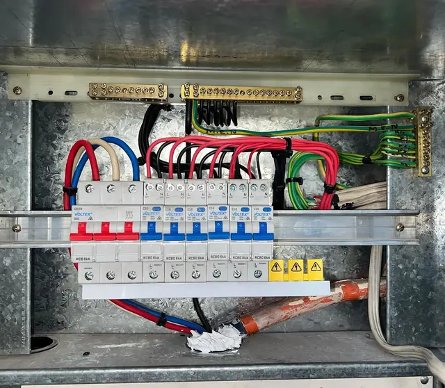 Switchboard with a row of RCBOs and neat red, blue and white cabling