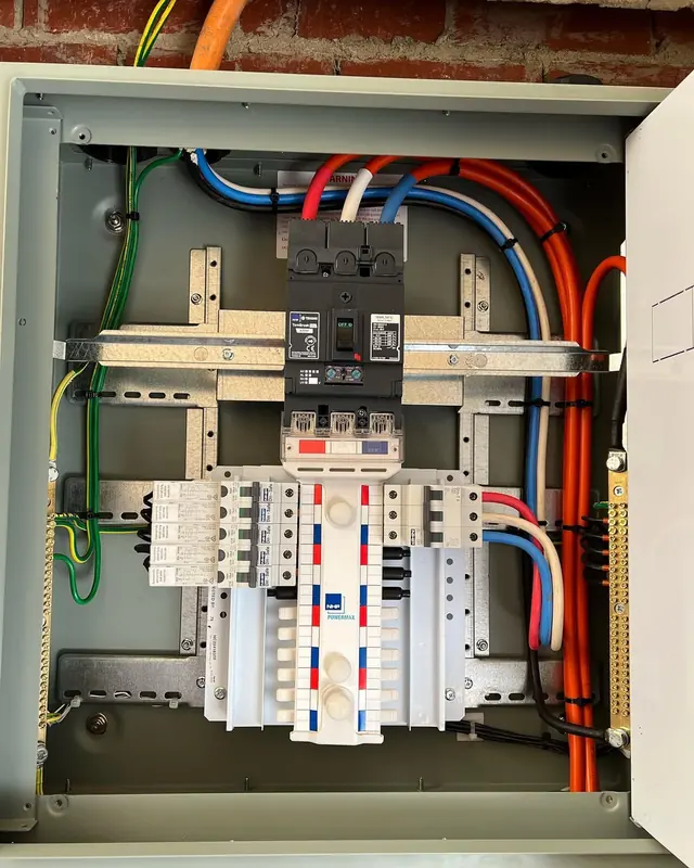 Three-phase switchboard in a metal enclosure with main switch and circuit breakers